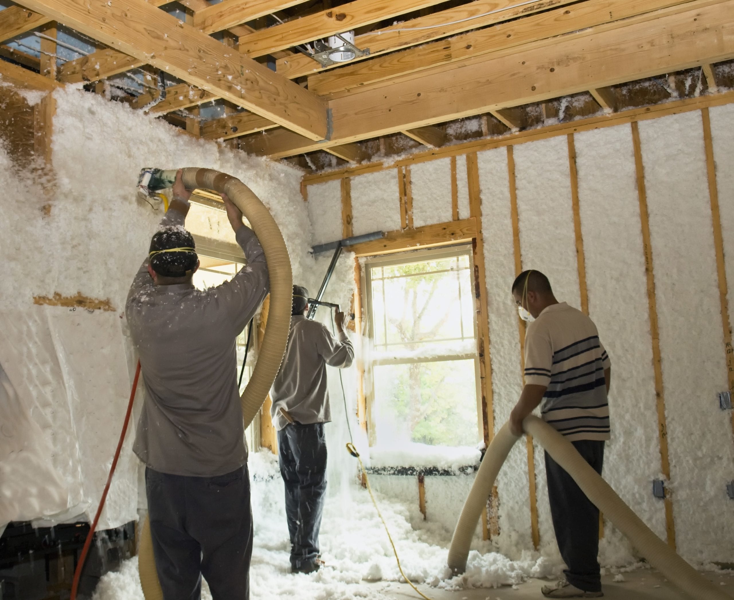 Our team working on an attic insulation project in Kansas City, MO
